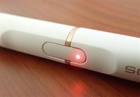 iqos flashing red and not charging.